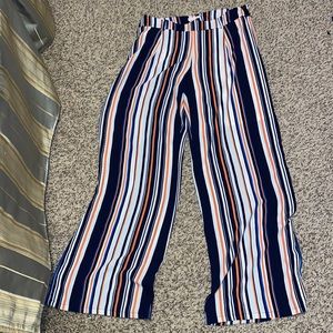 Women’s pants. Flared, striped pants with a tie.